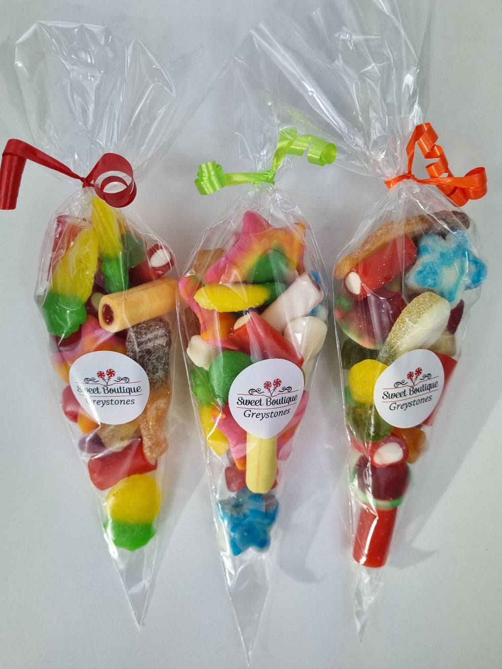 Party Bags presented in a cone shaped plastic bag and filled with a selection of Fizzy and gummy jellies