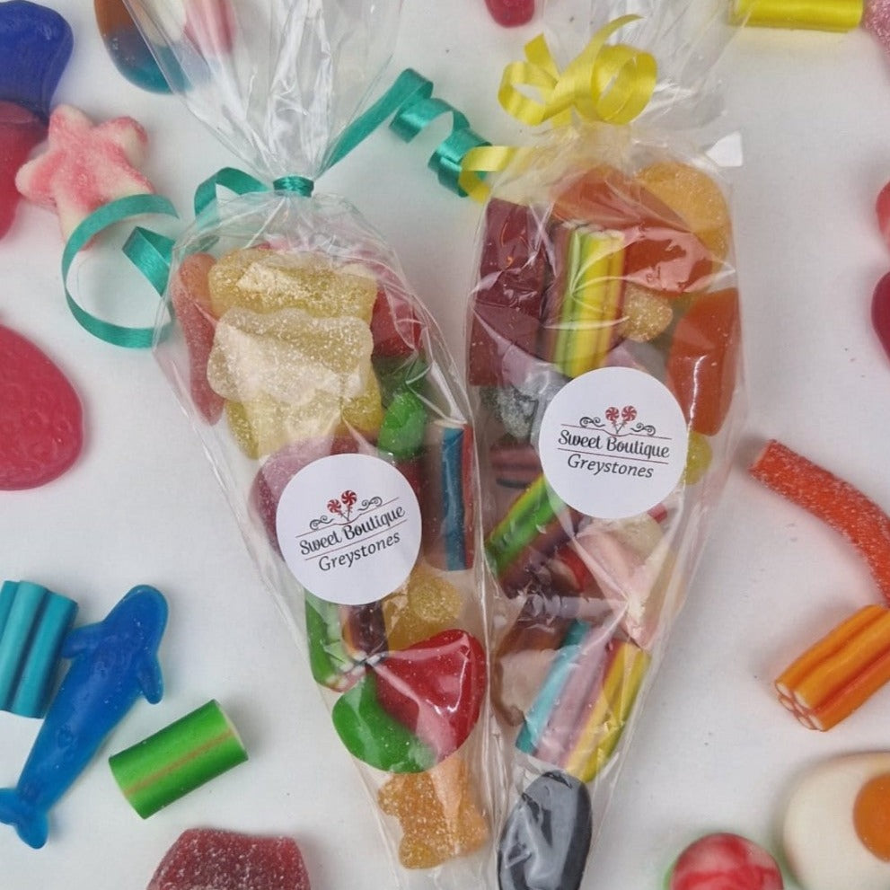 Party Bags presented in a cone shaped plastic bag and filled with a selection of Fizzy and gummy jellies