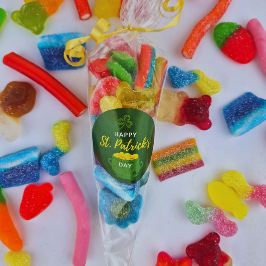 Bag of colorful gummy candies with a St. Patrick's Day label on a white background with more gummy candies.
